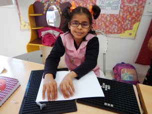 Visually impaired girl using Braille in Tunisia